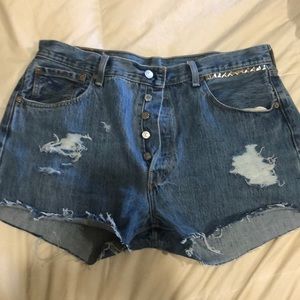 Levi 501 High waisted jean shorts distressed studs